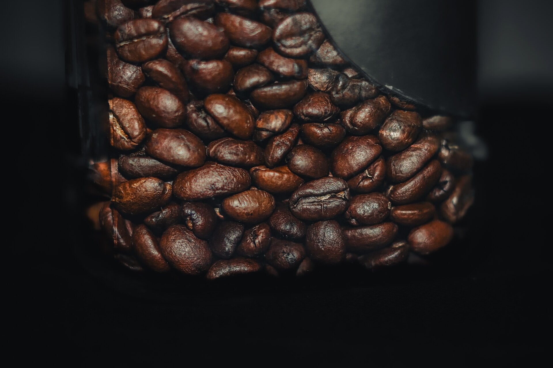 Roasted coffee beans stored in a jar