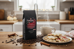 Pops Coffee Company Spiced Holiday Cookie bag on a kitchen counter with freshly baked Christmas cookies and steaming mug