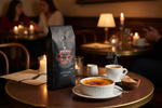 Pops Coffee Company Creme Brulee bag on a dark wood cafe table with torch-caramelized creme brulee and espresso