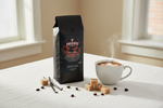 Pops Coffee Company Creme Brulee bag on a white linen tablecloth with steaming coffee, brown sugar cubes and vanilla bean