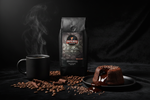 Pops Coffee Company Death by Chocolate bag on dark velvet with steaming coffee, chocolate lava cake and cocoa nibs