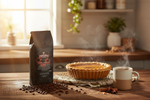 Pops Coffee Company Pumpkin Spice Blend bag on a kitchen counter with freshly baked pumpkin pie and steaming mug