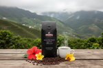 Pops Coffee Company Jamaican Blue Mountain bag at a lush Jamaican Blue Mountain coffee estate with misty peaks