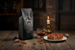 Pops Coffee Company Bourbon Pecan Torte bag on a rustic southern table with pecan torte, bourbon and whole pecans